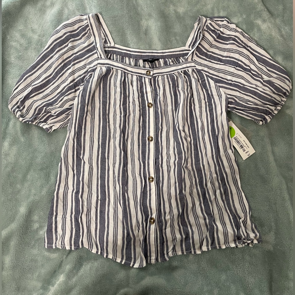 Blue and white shirt sleeve blouse.